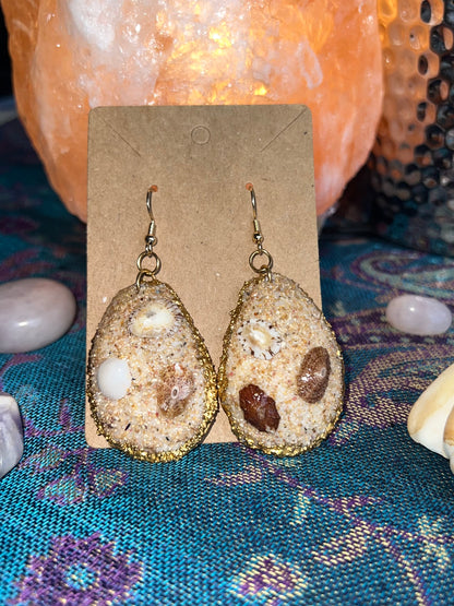 Aretes de caracoles y arena de las playas de Puerto Rico